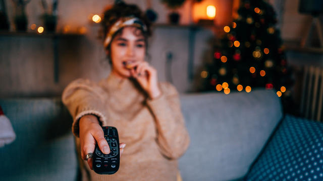 Woman watching tv at home 